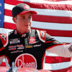 
              Christopher Bell waves before a NASCAR Cup Series auto race at Homestead-Miami Speedway, Sunday, Oct. 23, 2022, in Homestead, Fla. (AP Photo/Terry Renna)
            