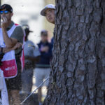 
              Tom Kim of South Korea hits from behind a tree on the 18th fairway during the first round of the CJ Cup golf tournament Thursday, Oct. 20, 2022, in Ridgeland, S.C. (AP Photo/Stephen B. Morton)
            