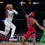 
              Boston Celtics guard Jaylen Brown (7) looks to pass while pressured by Toronto Raptors guard Gary Trent Jr. (33) during the first half of an NBA preseason basketball game, Wednesday, Oct. 5, 2022, in Boston. (AP Photo/Charles Krupa)
            