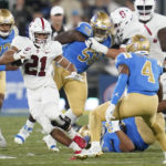 
              Stanford running back Caleb Robinson (21) runs the ball during the first half of an NCAA college football game against UCLA in Pasadena, Calif., Saturday, Oct. 29, 2022. (AP Photo/Ashley Landis)
            