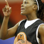 
              FILE - Texas forward Tiffany Jackson (33) points during Big 12 women's basketball tournament practice Monday, March 5, 2007 in Oklahoma City, Okla. Jackson, a former standout at the University of Texas who was the No. 5 pick in the WNBA draft in 2007 and played nine years in the league, has died of cancer, the school announced. She was 37. Jackson, who was first diagnosed with breast cancer in 2015, died Monday, Oct. 3, 2022. (AP Photo/Ty Russell)
            