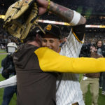 
              San Diego Padres third baseman Manny Machado, right, embraces manager Bob Melvin after the Padres defeated the Los Angeles Dodgers 5-3 in Game 4 of a baseball NL Division Series, Saturday, Oct. 15, 2022, in San Diego. (AP Photo/Ashley Landis)
            