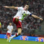 
              FILE - Poland's Robert Lewandowski controls the ball during the World Cup 2022 group I qualifying soccer match between Poland and England, at the Narodowy stadium in Warsaw, Wednesday, Sept. 8, 2021. (AP Photo/Czarek Sokolowski, File)
            