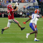 
              Georgia wide receiver Ladd McConkey (84) makes a reception in front of Florida cornerback Jason Marshall Jr. (3) during the first half of an NCAA college football game Saturday, Oct. 29, 2022, in Jacksonville, Fla. (AP Photo/John Raoux)
            