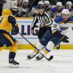 
              St. Louis Blues' Robert Thomas (18) moves the puck against Nashville Predators' Mikael Granlund (64) in the first period of an NHL hockey game Thursday, Oct. 27, 2022, in Nashville, Tenn. (AP Photo/Mark Humphrey)
            