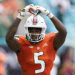 
              Miami wide receiver Key'Shawn Smith celebrates a touch down during the first half of an NCAA college football game against North Carolina, Saturday, Oct. 8, 2022, in Miami Gardens, Fla. (AP Photo/Wilfredo Lee)
            