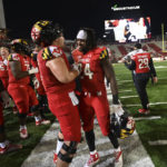 
              Maryland running back Roman Hemby (24) is congratulated on the sideline after defeating Northwestern 31-14 in an NCAA college football game, Saturday, Oct. 22, 2022, in College Park, Md. (AP Photo/Gail Burton)
            