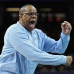 
              FILE - North Carolina coach Hubert Davis reacts during the second half of a college basketball game against Kansas in the finals of the NCAA men's college basketball tournament, April 4, 2022, in New Orleans. Four starters return from a team that showed off its best-case potential, while Davis has restocked a roster that was largely down to relying on an “Iron Five” starting lineup to close last year. (AP Photo/Brynn Anderson, File)
            