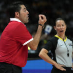 
              Canada's coach Víctor Lapena, left, argue with the referee during their bronze medal game at the women's Basketball World Cup in Sydney, Australia, Saturday, Oct. 1, 2022. (AP Photo/Rick Rycroft)
            