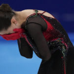 
              FILE - Kamila Valieva, of the Russian Olympic Committee, reacts after the women's free skate program during the figure skating competition at the 2022 Winter Olympics, Thursday, Feb. 17, 2022, in Beijing. Eight months after finishing behind the Russians at the Winter Games, the U.S. team has yet to receive its medals, or even know whether they will be silver or gold. That’s because only recently did the Russian Anti-Doping Agency complete its painfully slow investigation into Kamila Valieva, the now-16-year-old whose positive doping test that surfaced during the opening week of the Olympics led to its biggest scandal in years. (AP Photo/Bernat Armangue, File)
            