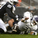 
              Northwestern quarterback Ryan Hilinski (3) fumbles the ball after being tackled by Penn State defensive end Nick Tarburton (46) as Adisa Isaac (20) looks on during the first half of an NCAA college football game Saturday, Oct. 1, 2022, in State College, Pa. (AP Photo/Barry Reeger)
            