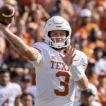 
              Texas quarterback Quinn Ewers (3) throws a pass during the first half of an NCAA college football game against Oklahoma at the Cotton Bowl, Saturday, Oct. 8, 2022, in Dallas. (AP Photo/Jeffrey McWhorter)
            