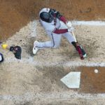 
              Arizona Diamondbacks' Christian Walker hits a double during the seventh inning of a baseball game against the Milwaukee Brewers Monday, Oct. 3, 2022, in Milwaukee. (AP Photo/Morry Gash)
            