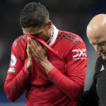 
              Manchester United's Raphael Varane, left, reacts as he leaves the field after he was injured during the English Premier League soccer match between Manchester United and Chelsea at the Stamford Bridge Stadium in London, Saturday, Oct. 22, 2022. (AP Photo/Frank Augstein)
            