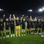 
              Portland Thorns FC celebrate with the trophy after they won the NWSL championship soccer match against the Kansas City Current, Saturday, Oct. 29, 2022, in Washington. Portland won 2-0. (AP Photo/Nick Wass)
            