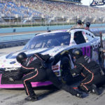 
              Trevor Bayne makes a pit stop during a NASCAR Xfinity Series auto race at Homestead-Miami Speedway, Saturday, Oct. 22, 2022, in Homestead, Fla. (AP Photo/Lynne Sladky)
            