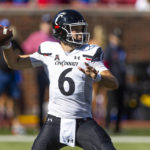 
              Cincinnati quarterback Ben Bryant (6) throws a pass during the first half of an NCAA college football game against SMU, Saturday, Oct. 22, 2022, in Dallas. (AP Photo/Brandon Wade)
            