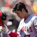 
              Los Angeles Angels' Shohei Ohtani walks to the dugout after pitching against the Oakland Athletics during the fifth inning of a baseball game in Oakland, Calif., Wednesday, Oct. 5, 2022. (AP Photo/Godofredo A. Vásquez)
            