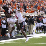 
              Oklahoma State's Jaden Bray (85) catches the ball as Texas Tech's Rayshad Williams (0) attempts to block the pass during the second half of an NCAA college football game in Stillwater, Okla., Saturday, Oct. 8, 2022. (AP Photo/Mitch Alcala)
            