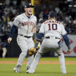 
              Houston Astros third baseman Alex Bregman (2) and first baseman Yuli Gurriel (10) celebrate after the Astros defeated the New York Yankees 6-5 to win Game 4 and the American League Championship baseball series, Monday, Oct. 24, 2022, in New York. (AP Photo/John Minchillo)
            