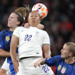 
              United States' Sam Coffey, left, challenges for the ball with England's Lauren James during the women's friendly soccer match between England and the US at Wembley stadium in London, Friday, Oct. 7, 2022. (AP Photo/Kirsty Wigglesworth)
            