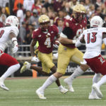 
              Boston College widereceiver Zay Flowers gains yards during the first half of an NCAA college football game against Louisville, Saturday, Oct. 1, 2022, in Boston. (AP Photo/Mark Stockwell)
            