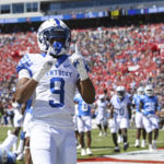 
              Kentucky wide receiver Tayvion Robinson (9) reacts after a 5-yard touchdown catch during the first half of an NCAA college football game against Mississippi in Oxford, Miss., Saturday, Oct. 1, 2022. (AP Photo/Thomas Graning)
            