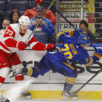 
              Detroit Red Wings left wing Adam Erne (73) and Buffalo Sabres defenseman Jacob Bryson (78) collide along the boards during the second period of an NHL hockey game, Monday, Oct. 31, 2022, in Buffalo, N.Y. (AP Photo/Jeffrey T. Barnes)
            