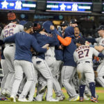 
              The Houston Astros celebrate after defeating the New York Yankees 6-5 to win Game 4 and the American League Championship baseball series, Monday, Oct. 24, 2022, in New York. (AP Photo/John Minchillo)
            