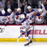 
              Edmonton Oilers center Connor McDavid (97) celebrates with teammates after scoring a goal during the third period of an NHL hockey game against the Chicago Blackhawks in Chicago, Thursday, Oct. 27, 2022. (AP Photo/Nam Y. Huh)
            