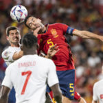 
              FILE - Swiss Remo Freuler, left, fights for a header with Spain's midfielder Sergio Busquets, during the UEFA Nations League group A2 soccer match between Spain and Switzerland at the Romareda stadium in Zaragoza, Spain, Saturday, Sept. 24, 2022. (Jean-Christophe Bott/Keystone via AP, File)
            