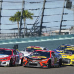 
              Kyle Larson (5), Martin Truex Jr. (19) and Ryan Blaney (12) approach the start finish line after a yellow caution flag during a NASCAR Cup Series auto race at Homestead-Miami Speedway, Sunday, Oct. 23, 2022, in Homestead, Fla. (AP Photo/Terry Renna)
            