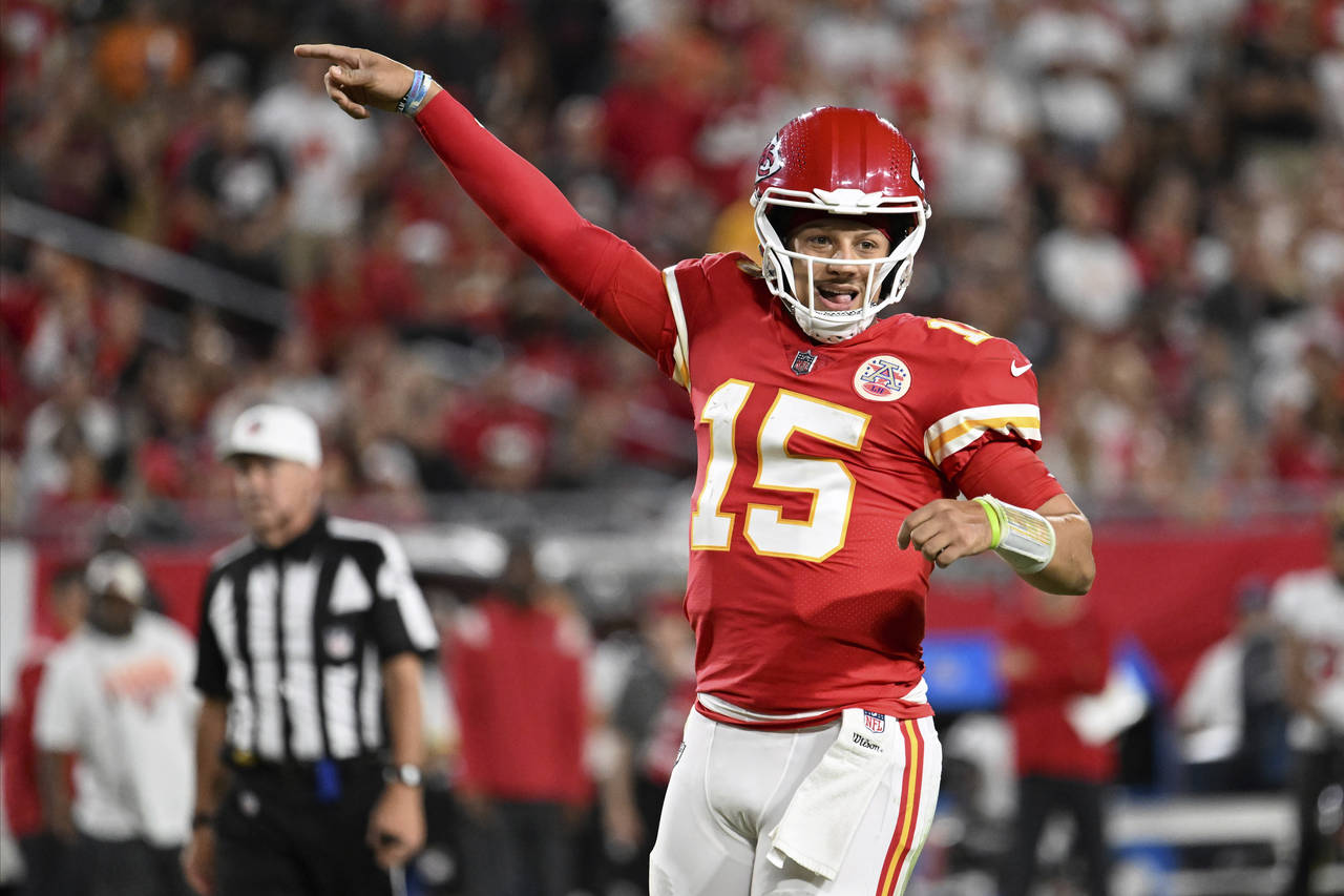 Kansas City Chiefs quarterback Patrick Mahomes (15) celebrates a touchdown during the first half of...