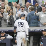 
              Fans cheer New York Yankees' Aaron Judge walks to the dugout after striking out in the eighth inning of a baseball game against the Baltimore Orioles, Saturday, Oct. 1, 2022, in New York. (AP Photo/Mary Altaffer)
            