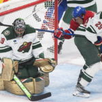 
              Minnesota Wild goaltender Marc-Andre Fleury (29) makes a save against Montreal Canadiens' Brendan Gallagher (11) as Wild's Jonas Brodin (25) defends during the first period of an NHL hockey game, Tuesday, Oct. 25, 2022 in Montreal. (Graham Hughes/The Canadian Press via AP)
            