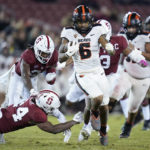
              Oregon State running back Damien Martinez (6) runs the ball for a 43-yard touchdown as Stanford safety Patrick Fields (24) tries to tackle him during the second half of an NCAA college football game in Stanford, Calif., Saturday, Oct. 8, 2022. (AP Photo/Godofredo A. Vásquez)
            