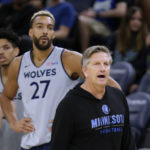 
              Minnesota Timberwolves coach Chris Finch directs practice for the NBA basketball team, while new Timberwolves center Rudy Gobert (27) watches, Saturday, Oct. 1, 2022, in Minneapolis. (AP Photo/Andy Clayton-King)
            