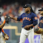 
              Houston Astros starting pitcher Framber Valdez, center, speaks with Jeremy Pena, left, on the mound during the seventh inning in Game 2 of baseball's World Series between the Houston Astros and the Philadelphia Phillies on Saturday, Oct. 29, 2022, in Houston. (AP Photo/Eric Gay)
            