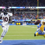 
              Los Angeles Chargers cornerback Asante Samuel Jr. (26) can't make the interception as Denver Broncos wide receiver Jerry Jeudy (10) looks on during the first half of an NFL football game, Monday, Oct. 17, 2022, in Inglewood, Calif. (AP Photo/Marcio Jose Sanchez)
            