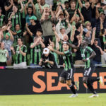 
              Austin FC forward Moussa Djitte (2) celebrates his goal with teammate Sebastian Driussi (7) during the first half an MLS playoff soccer match against FC Dallas, Sunday, Oct. 23, 2022, in Austin, Texas. (AP Photo/Michael Thomas)
            