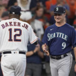 
              Houston Astros manager Dusty Baker Jr. (12) and Seattle Mariners manager Scott Servais (9) greet before Game 1 of an American League Division Series baseball game in Houston,Tuesday, Oct. 11, 2022. (AP Photo/David J. Phillip)
            