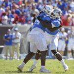 
              Mississippi defensive tackle JJ Pegues (89) and defensive end Cedric Johnson (2) react after a fumble recovery during the second half of an NCAA college football game against Kentucky in Oxford, Miss., Saturday, Oct. 1, 2022. Mississippi won 22-19. (AP Photo/Thomas Graning)
            