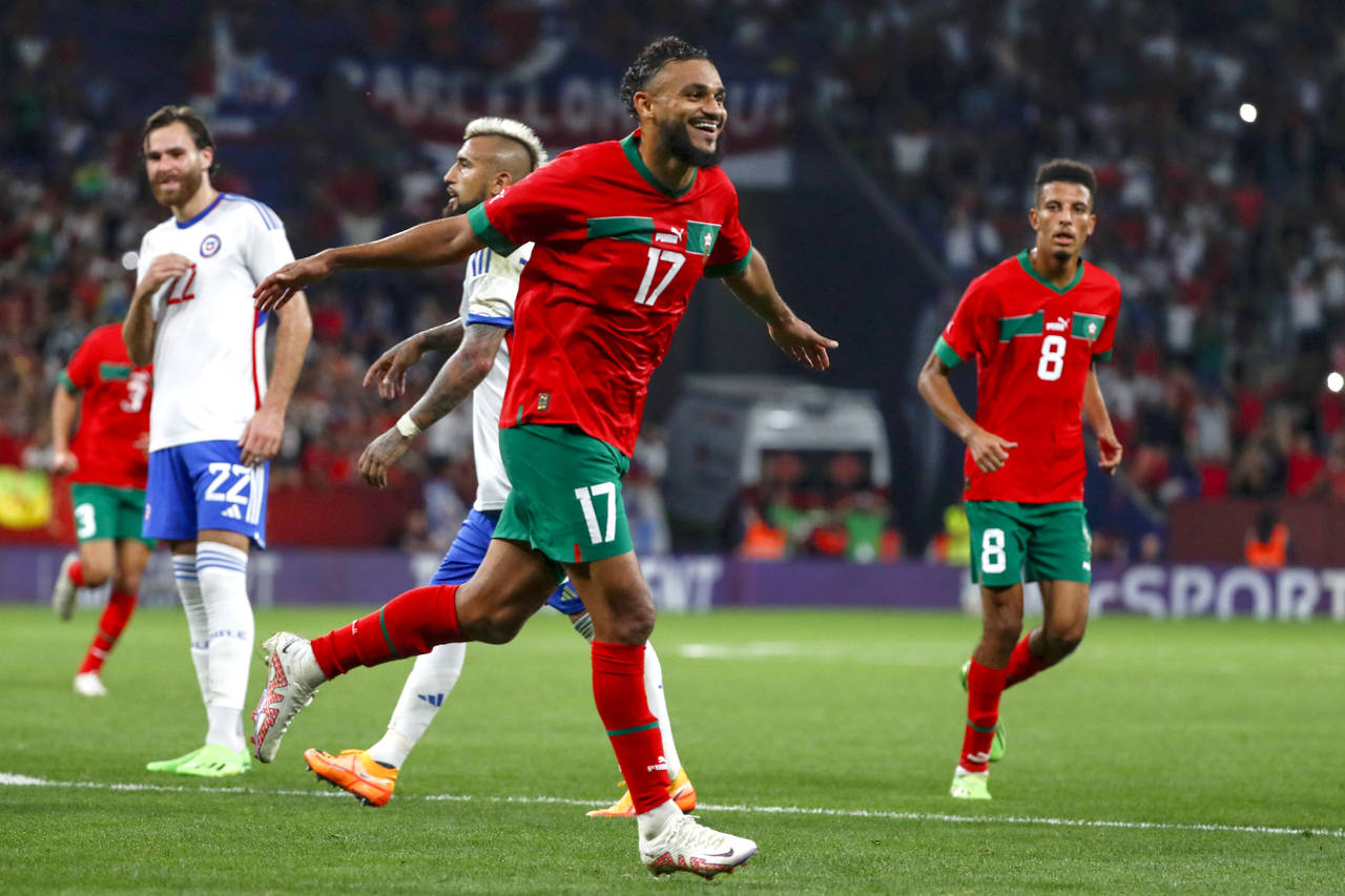 FILE - Morocco's Sofiane Boufal celebrates after scoring the opening goal during an international f...