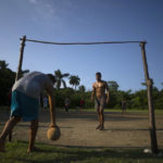 
              Locals play soccer on an old baseball field in the Santa Fe municipality of Guanabacoa east of Havana, Cuba, Saturday, Oct. 15, 2022. Soccer coaches across Cuba are training dozens of players as part of a new program to elevate the sport's profile and status in a country that last qualified for the FIFA World Cup in 1938. (AP Photo/Ramon Espinosa)
            