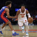 
              New York Knicks guard Jalen Brunson drives to the basket past Detroit Pistons guard Cade Cunningham during the second half of an NBA basketball game Friday, Oct. 21, 2022, in New York. The Knicks won 130-106. (AP Photo/Adam Hunger)
            