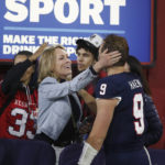 
              Fresno State quarterback Jake Haener gets a hug from his mother, Julie, after a come-from-behind win against San Diego State during the second half of an NCAA college football game in Fresno, Calif., Saturday, Oct. 29, 2022. (AP Photo/Gary Kazanjian)
            