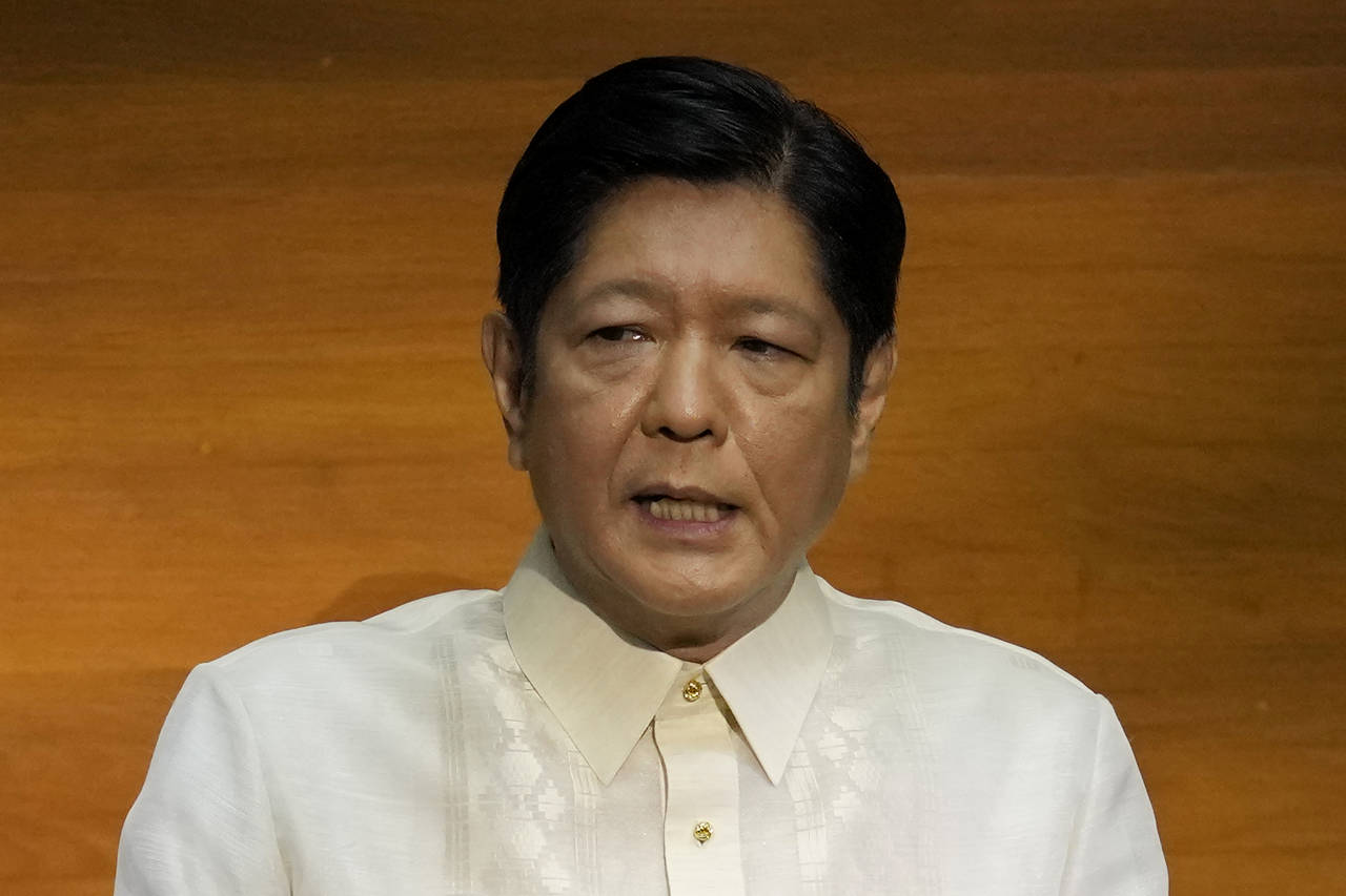 FILE - Philippine President Ferdinand Marcos Jr. delivers his first state of the nation address in ...