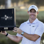 
              Rory McIlroy, of Northern Ireland, holds the winning trophy after the final round of the CJ Cup golf tournament Sunday, Oct. 23, 2022, in Ridgeland, S.C. (AP Photo/Stephen B. Morton)
            
