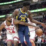 
              Chicago Bulls' Patrick Williams (44) battles Indiana Pacers' Jalen Smith for a rebound during the first half of an NBA basketball game Wednesday, Oct. 26, 2022, in Chicago. (AP Photo/Charles Rex Arbogast)
            