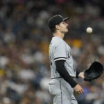 
              Chicago White Sox starting pitcher Dylan Cease tosses the ball on the mound before facing a San Diego Padres batter during the sixth inning of a baseball game Saturday, Oct. 1, 2022, in San Diego. (AP Photo/Gregory Bull)
            
